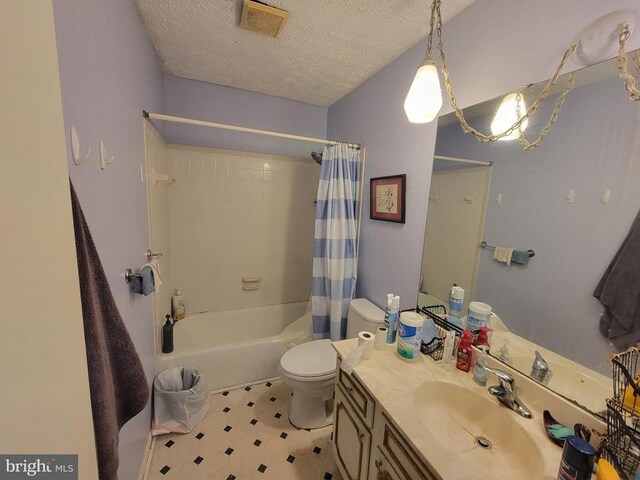 216 Wakefield Dr, Locust Grove, VA 22508 - bathroom with toilet, vanity, shower / bath combo with shower curtain, a textured ceiling, and tile patterned floors