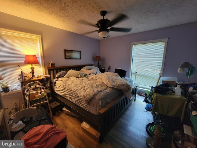 216 Wakefield Dr, Locust Grove, VA 22508 - bedroom with a textured ceiling, wood finished floors, and a ceiling fan