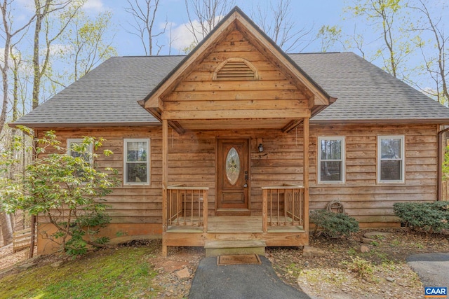 view of front of house with roof with shingles