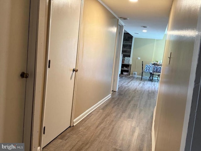  - corridor with wood finished floors and baseboards