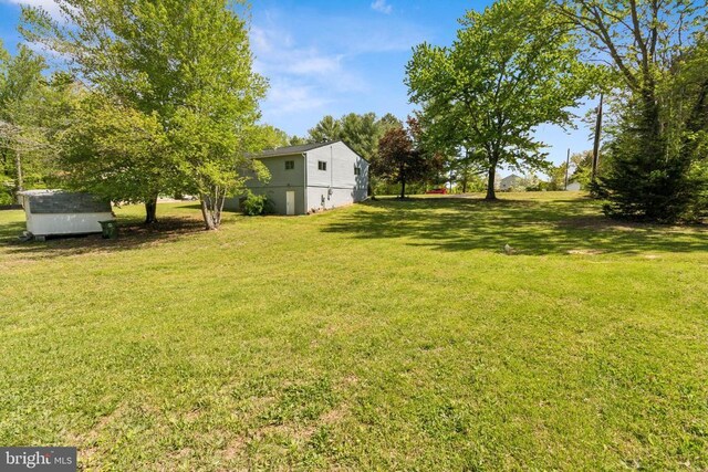 92 Aspen Hill Rd, Mineral, VA 23117 - view of grassy yard with a storage shed and an outdoor structure
