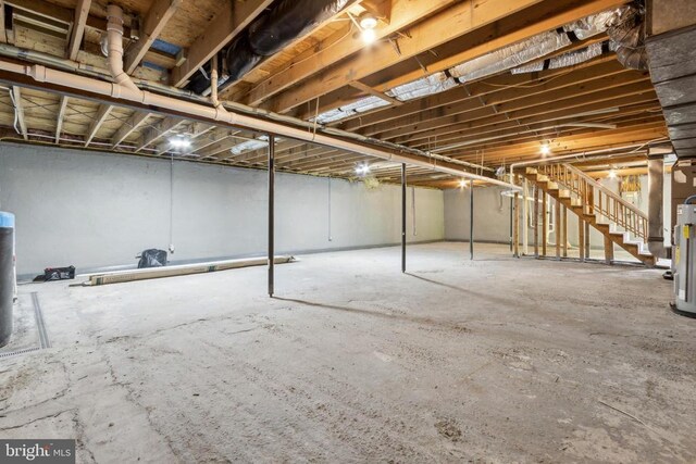 92 Aspen Hill Rd, Mineral, VA 23117 - unfinished below grade area with stairway and gas water heater