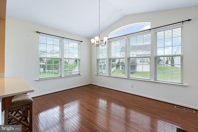 5505 Spring Bluff Ct, Fredericksburg, VA 22407 - unfurnished dining area featuring healthy amount of natural light, lofted ceiling, a chandelier, wood-type flooring, and baseboards