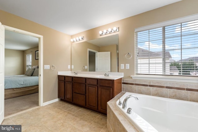 5505 Spring Bluff Ct, Fredericksburg, VA 22407 - bathroom featuring double vanity, ensuite bath, a bath, tile patterned floors, and baseboards