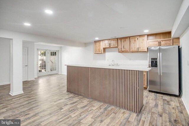 5409 Rich Mountain Way E, Fredericksburg, VA 22407 - kitchen featuring stainless steel fridge, recessed lighting, light countertops, light wood-style floors, and baseboards