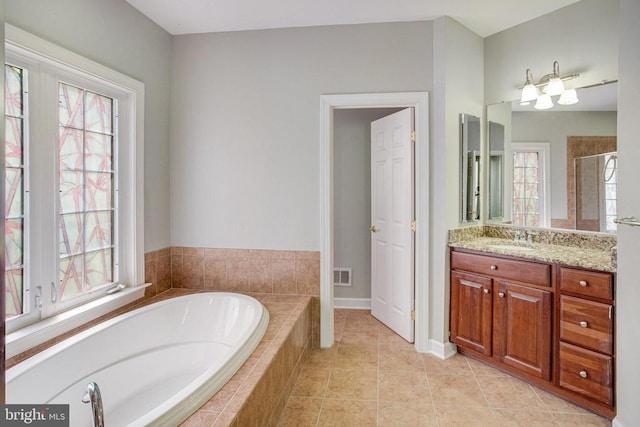 5409 Rich Mountain Way E, Fredericksburg, VA 22407 - bathroom with a garden tub, healthy amount of natural light, a stall shower, and vanity