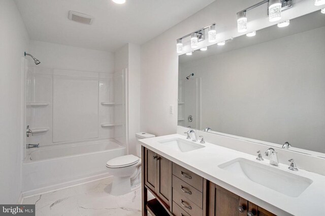 5409 Rich Mountain Way E, Fredericksburg, VA 22407 - bathroom with marble look tile flooring, double vanity, bathing tub / shower combination, and toilet