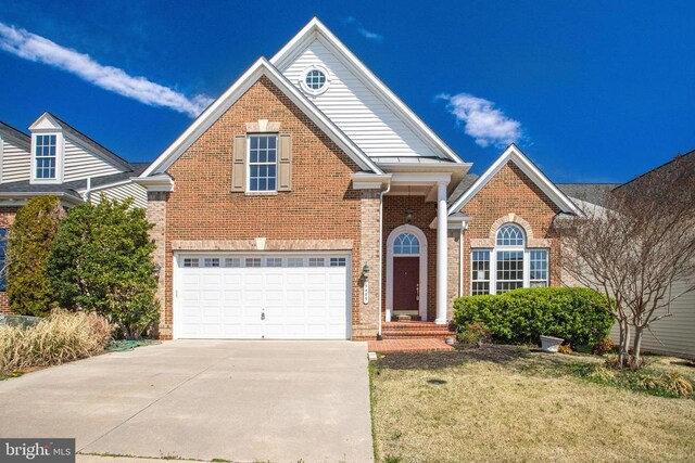 5409 Rich Mountain Way E, Fredericksburg, VA 22407 - traditional-style home with driveway, an attached garage, brick siding, and a front yard
