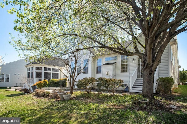 5409 Rich Mountain Way E, Fredericksburg, VA 22407 - rear view of house with a lawn and a sunroom