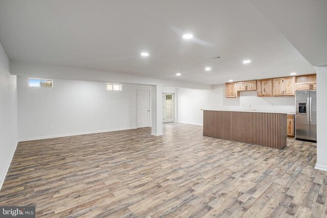 5409 Rich Mountain Way E, Fredericksburg, VA 22407 - kitchen featuring stainless steel fridge with ice dispenser, open floor plan, light wood-type flooring, and recessed lighting