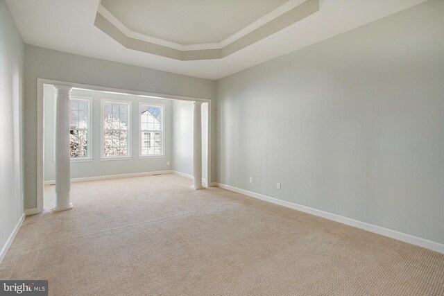5409 Rich Mountain Way E, Fredericksburg, VA 22407 - unfurnished room with decorative columns, a raised ceiling, light colored carpet, baseboards, and crown molding