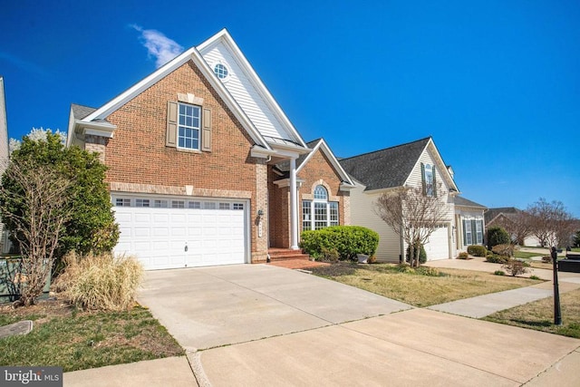 5409 Rich Mountain Way E, Fredericksburg, VA 22407 - traditional home with an attached garage, brick siding, and concrete driveway