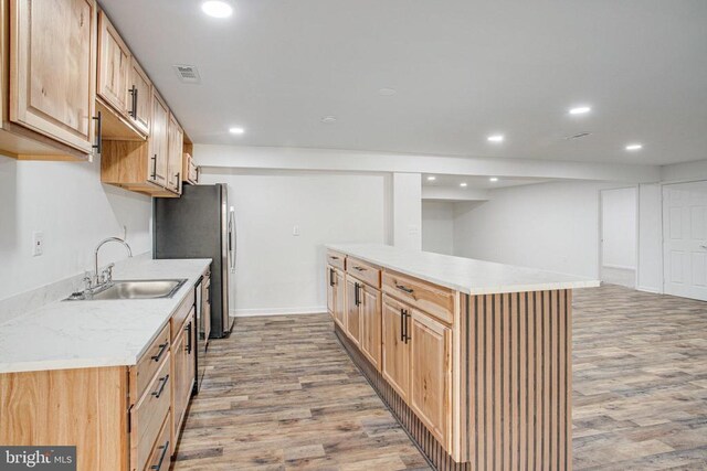 5409 Rich Mountain Way E, Fredericksburg, VA 22407 - kitchen featuring a sink, light wood-style flooring, recessed lighting, freestanding refrigerator, and baseboards