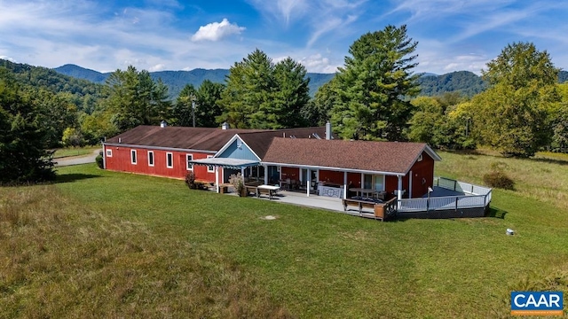 2256 Adial Rd, Faber, VA 22938 - rear view of property featuring a mountain view, a wooded view, and a lawn