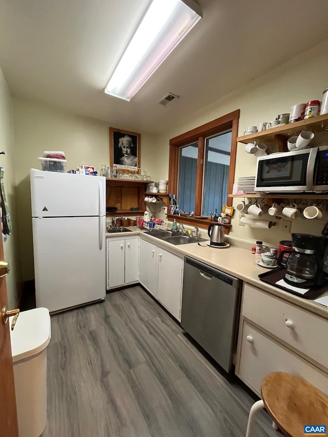 2256 Adial Rd, Faber, VA 22938 - kitchen with a sink, stainless steel appliances, wood finished floors, visible vents, and white cabinetry