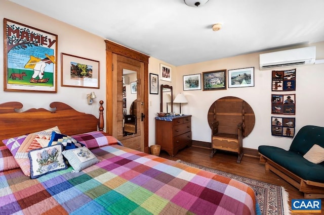 2256 Adial Rd, Faber, VA 22938 - bedroom featuring baseboards, a wall mounted air conditioner, and wood finished floors