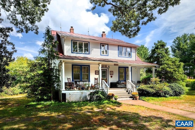 2256 Adial Rd, Faber, VA 22938 - view of front facade with a chimney, metal roof, a porch, and a standing seam roof