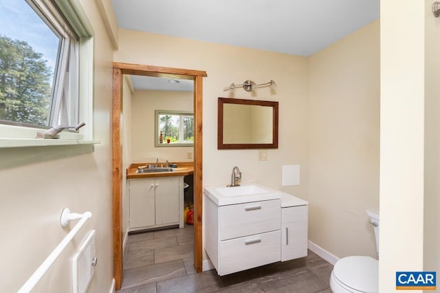 2256 Adial Rd, Faber, VA 22938 - half bathroom featuring toilet, baseboards, tile patterned floors, and vanity