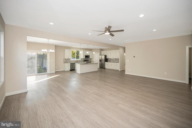 400 Constitution Blvd, Locust Grove, VA 22508 - unfurnished living room featuring a ceiling fan, baseboards, recessed lighting, and light wood-type flooring