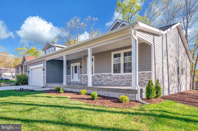 400 Constitution Blvd, Locust Grove, VA 22508 - view of front of property featuring an attached garage, covered porch, a front yard, driveway, and stone siding