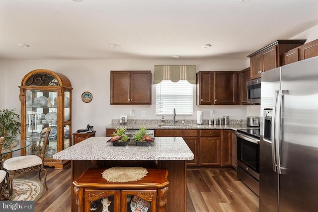 35079 Orchid Ln, Locust Grove, VA 22508 - kitchen with appliances with stainless steel finishes, a sink, dark wood finished floors, and light stone counters