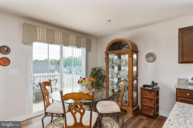 35079 Orchid Ln, Locust Grove, VA 22508 - dining room with dark wood-style flooring and baseboards