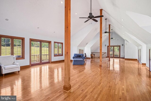bonus room featuring ceiling fan, light wood finished floors, and baseboards