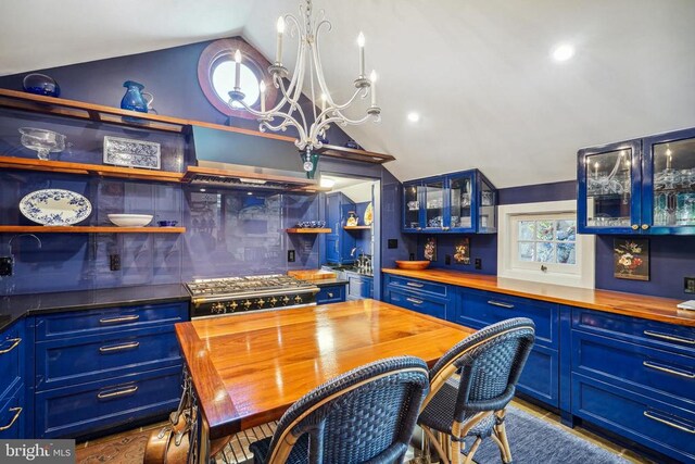dining space featuring lofted ceiling and a chandelier