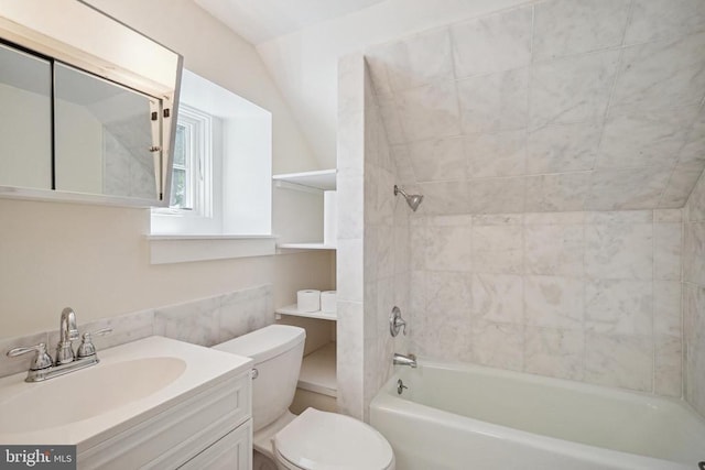 bathroom with toilet, vanity, and bathtub / shower combination