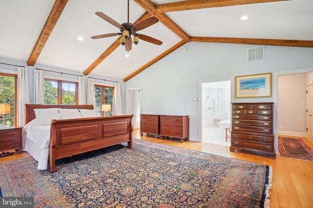 bedroom with wood finished floors, baseboards, ensuite bathroom, and recessed lighting