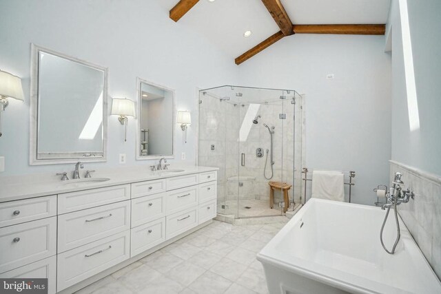 full bath featuring a freestanding bath, a stall shower, and double vanity