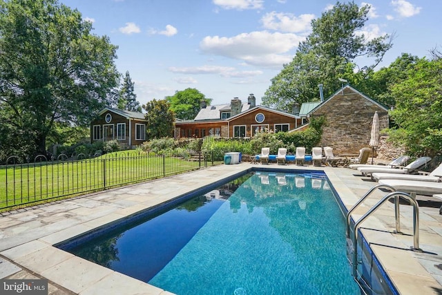 swimming pool featuring a patio area