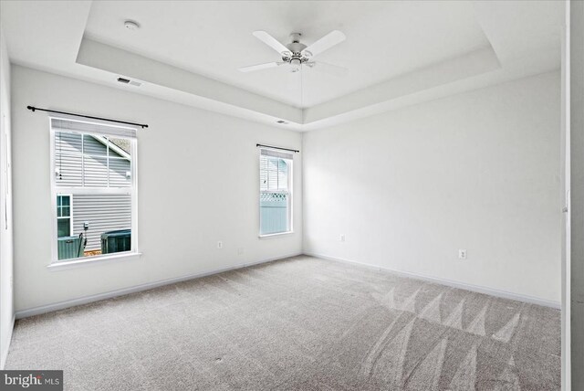 6607 Golden Pheasant Run, Fredericksburg, VA 22407 - spare room featuring a raised ceiling, carpet flooring, baseboards, a smoke detector, and ceiling fan