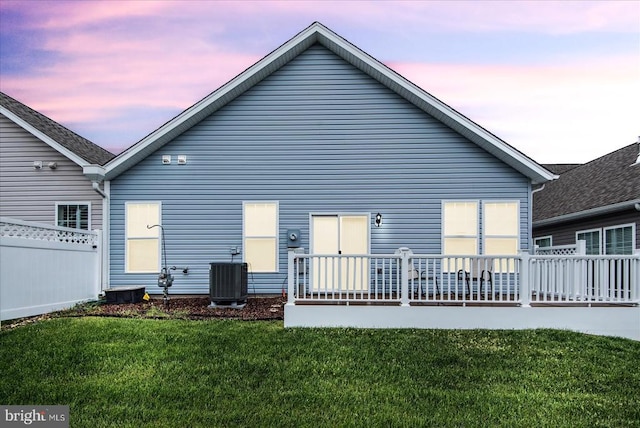 6607 Golden Pheasant Run, Fredericksburg, VA 22407 - back of property at dusk featuring central air condition unit