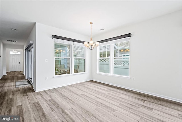 6607 Golden Pheasant Run, Fredericksburg, VA 22407 - unfurnished dining area featuring a chandelier, wood finished floors, and baseboards