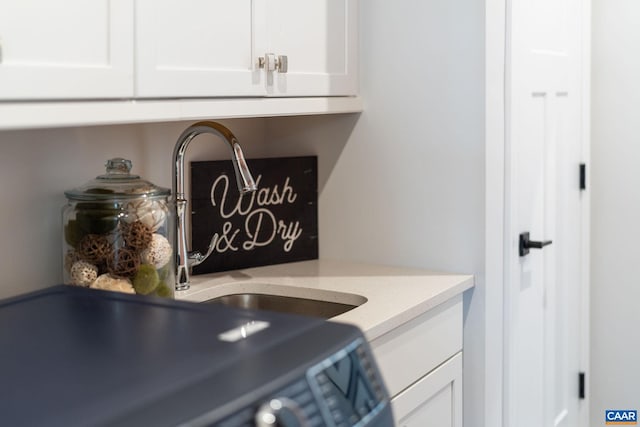 760 Arboleda Dr, Crozet, VA 22932 - kitchen view of white cabinetry, light stone counters, and a sink