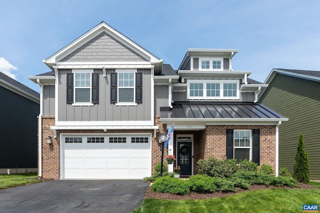 760 Arboleda Dr, Crozet, VA 22932 - craftsman inspired home with asphalt driveway, brick siding, an attached garage, board and batten siding, and a standing seam roof