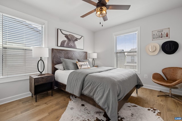 1261 Old Trail Dr, Crozet, VA 22932 - bedroom featuring baseboards, light wood-type flooring, and ceiling fan