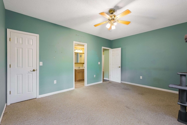 4056 Palmer Rd, Mcgaheysville, VA 22840 - unfurnished bedroom featuring light carpet, ensuite bathroom, ceiling fan, and a textured ceiling
