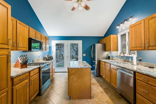 4056 Palmer Rd, Mcgaheysville, VA 22840 - kitchen featuring stainless steel appliances, vaulted ceiling, a kitchen island, ceiling fan, and light stone counters
