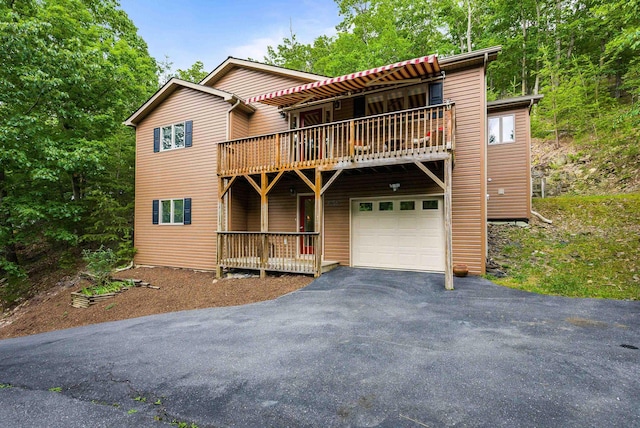 4056 Palmer Rd, Mcgaheysville, VA 22840 - view of front of home featuring asphalt driveway, an attached garage, and a balcony