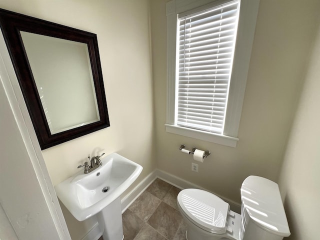 bathroom featuring sink and toilet