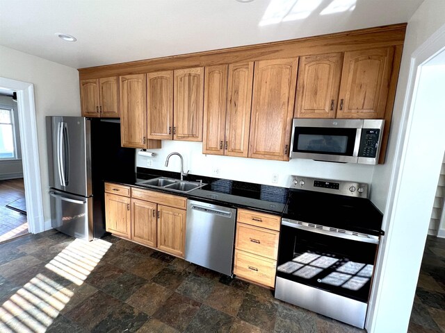 kitchen with sink and appliances with stainless steel finishes