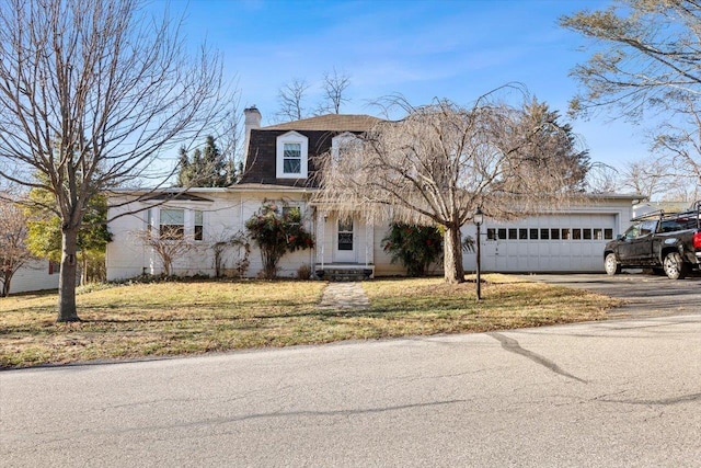 419 College Cir, Staunton, VA 24401 - view of front of house featuring an attached garage, driveway, a chimney, and a front lawn