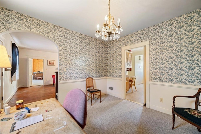 419 College Cir, Staunton, VA 24401 - interior space with a wainscoted wall, wallpapered walls, arched walkways, a chandelier, and wood finished floors