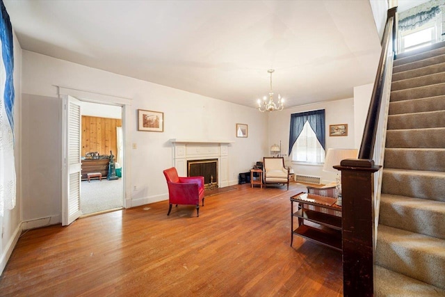 419 College Cir, Staunton, VA 24401 - living room with stairs, wood finished floors, a chandelier, and baseboards