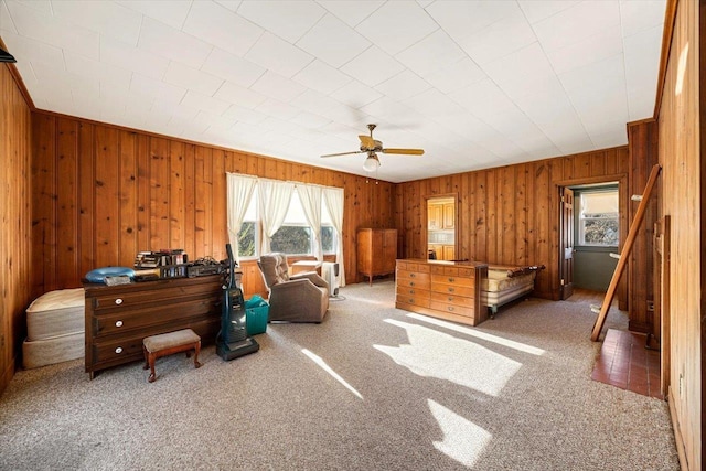 419 College Cir, Staunton, VA 24401 - carpeted bedroom with wood walls and ceiling fan