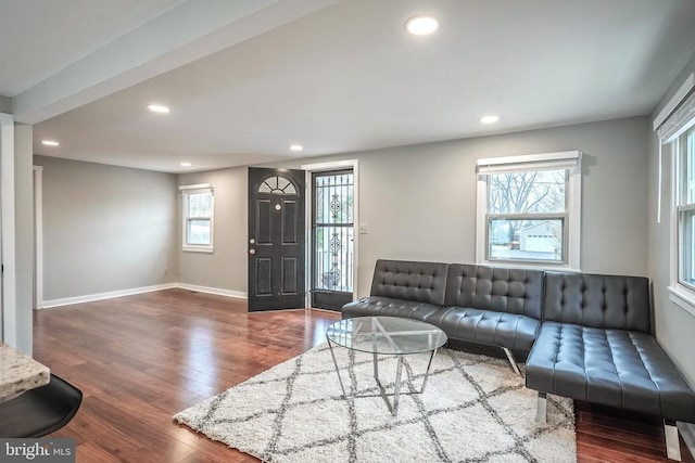 living room featuring recessed lighting, wood finished floors, and baseboards