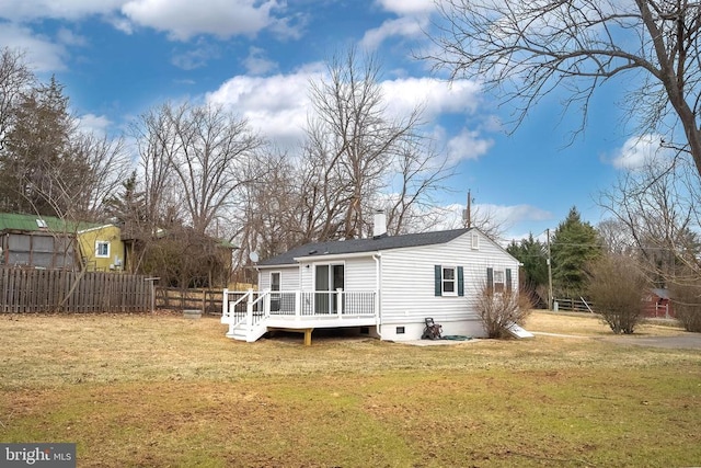 back of house with a wooden deck