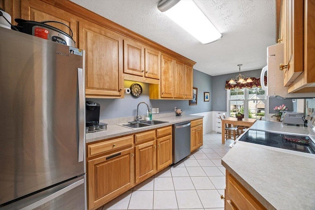 35 Hickory Nut Ln, Staunton, VA 24401 - kitchen featuring appliances with stainless steel finishes, a sink, a chandelier, light tile patterned flooring, and light countertops